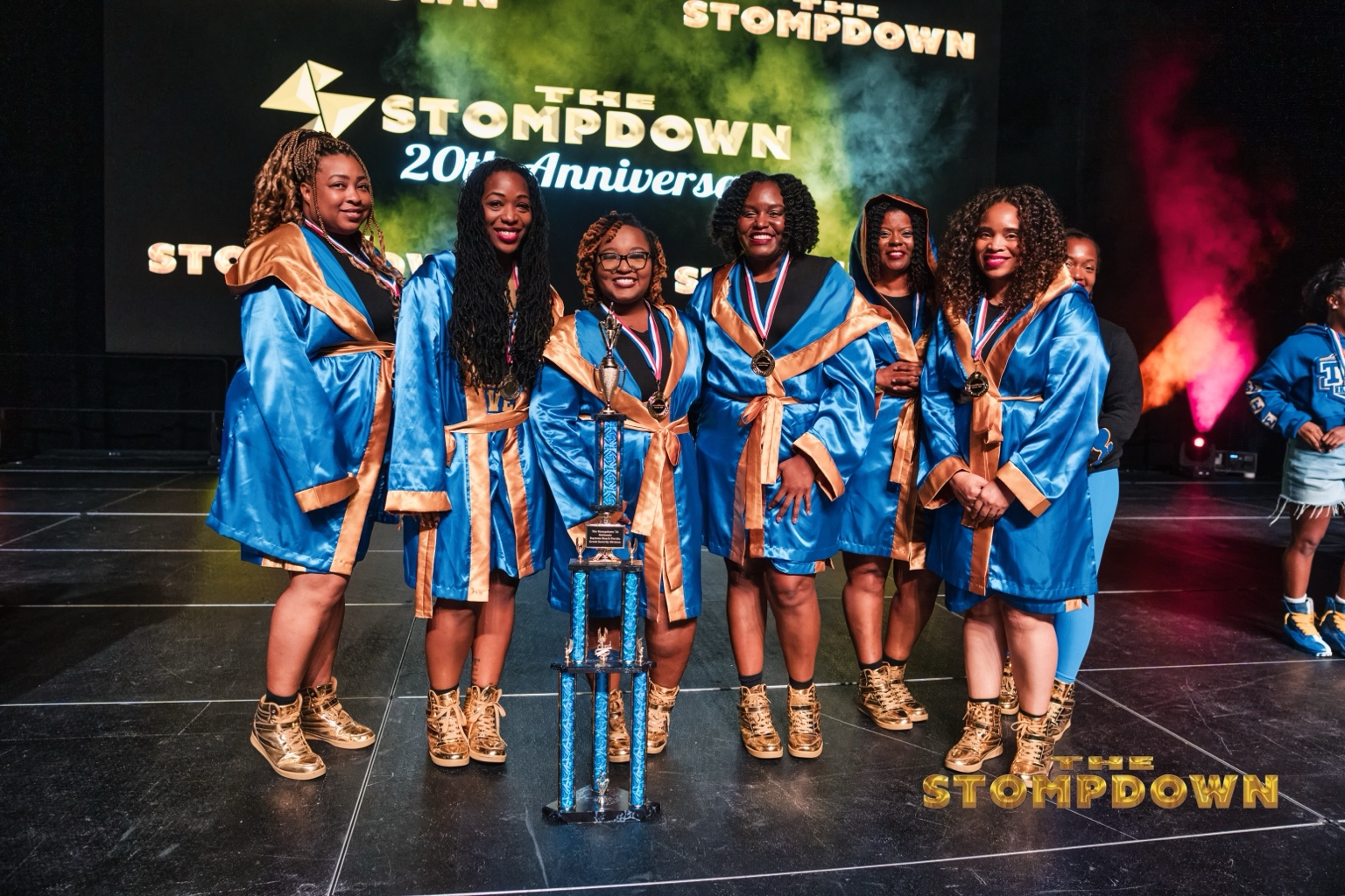 Championship team celebrating with trophy at The Stompdown