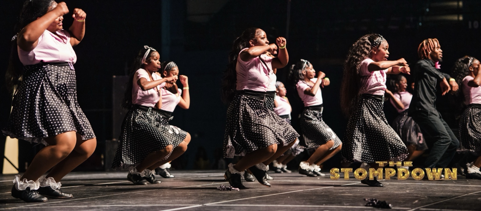 Step team delivering a synchronized stage performance